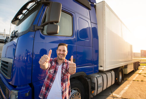 Portrait,Of,Happy,Smiling,Middle,Aged,Truck,Driver,Standing,By